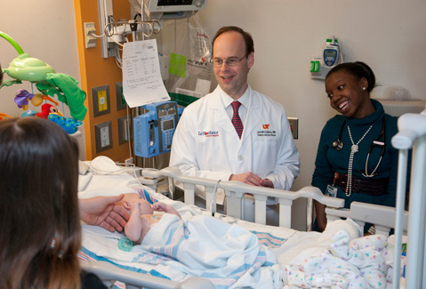 Two Doctors checking on a patient