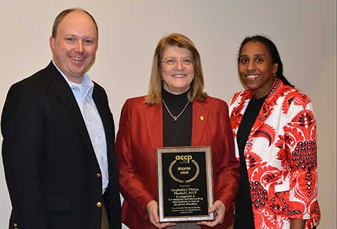 Shown L to R:  Drs. David Rogers and Stephanie Phelps and UTCOP Dean Chisholm-Burns