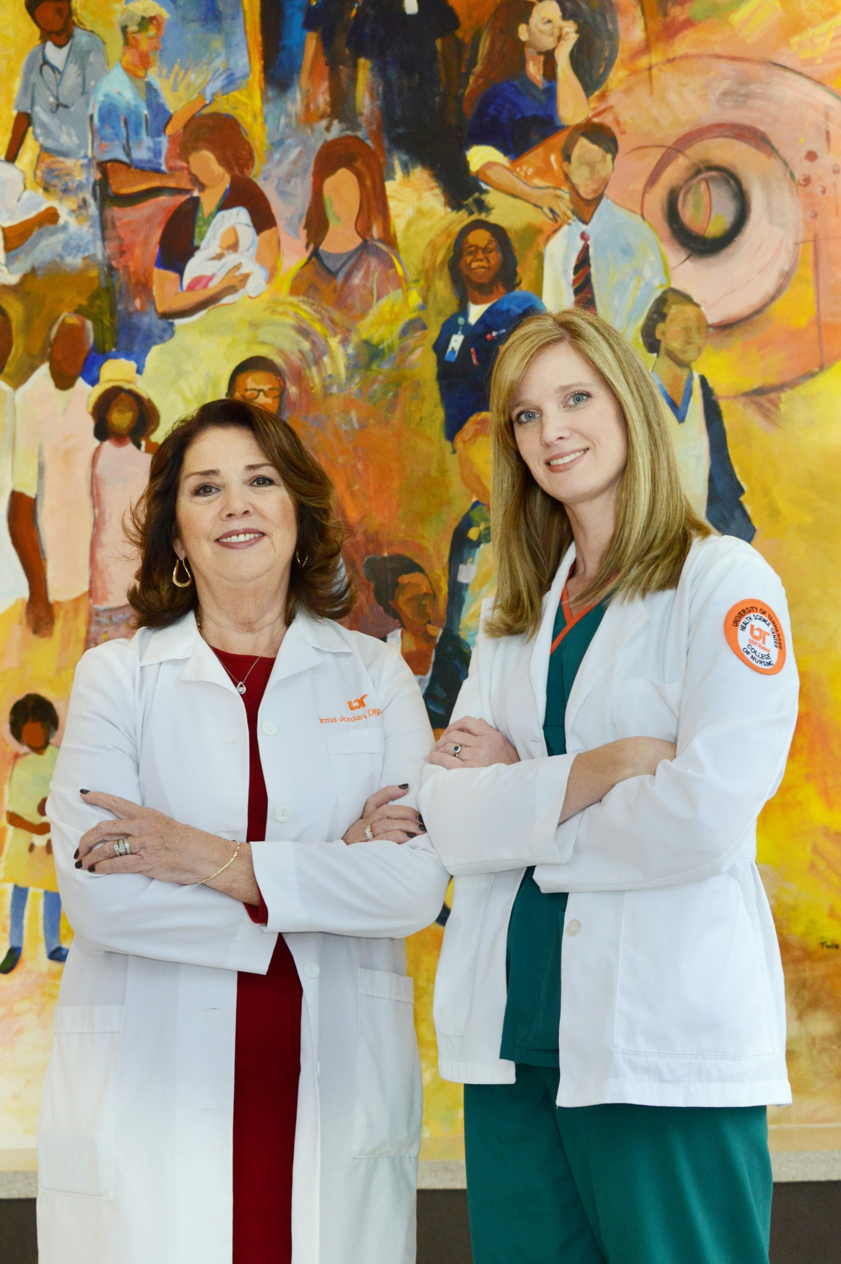 Irma Jordan, DNP (left), assistant professor in the University of Tennessee Health Science Center College of Nursing, will have the pleasure of presenting her daughter, Lisa Dawson, with her Bachelor of Science in Nursing degree at the Dec. 12 UTHSC commencement ceremony. The two enjoy a short break in front of a mural at Methodist South Hospital, where Lisa is completing her clinical training.   