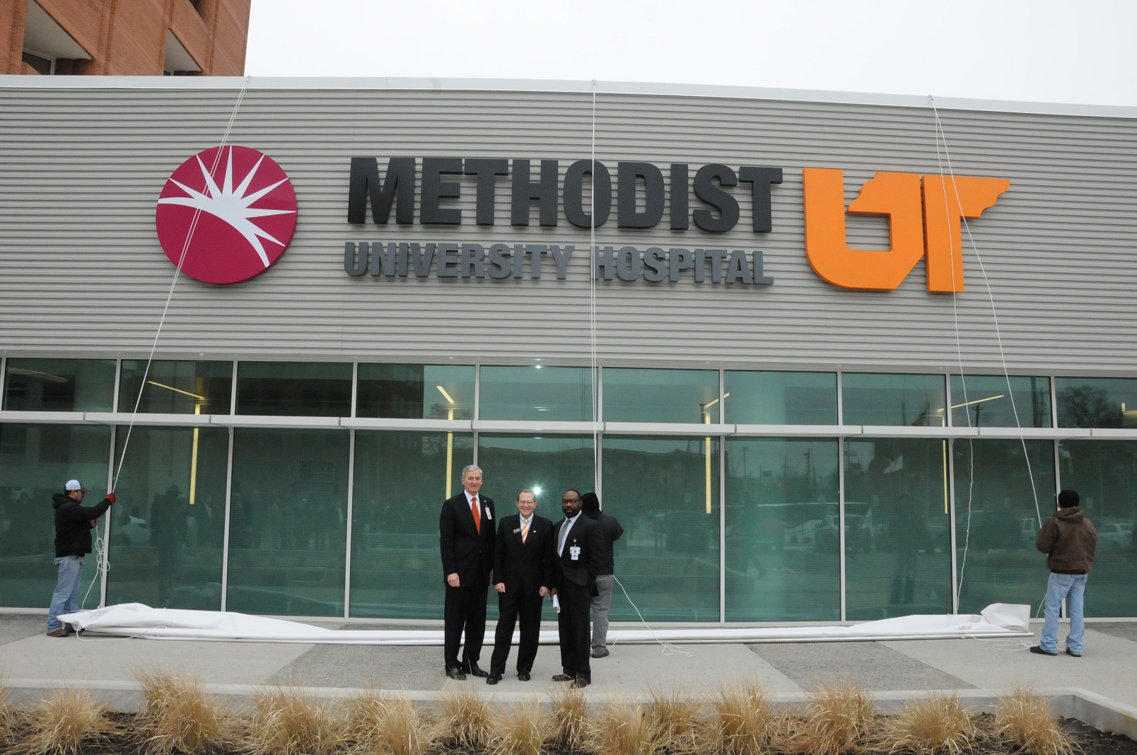 From left, Methodist Le Bonheur Healthcare CEO Gary Shorb, UTHSC Chancellor Steve Schwab, MD, and Methodist Le Bonheur Healthcare President and COO Michael Ugwueke share congratulations after the unveiling.