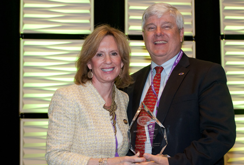 Dr. Michael Carter receives the National Organization of Nurse Practitioner Faculties 2015 Lifetime Achievement Award from Sheila Melander, PhD, RN, ACNP-BC, FCCM, FAANP, the organization’s president and a former UTHSC professor.