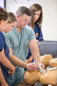 Kristopher Maday instructs PA students in the UTHSC Center for Health Care Improvement and Patient Simulation.