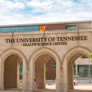 Photo of campus arches with dental building behind